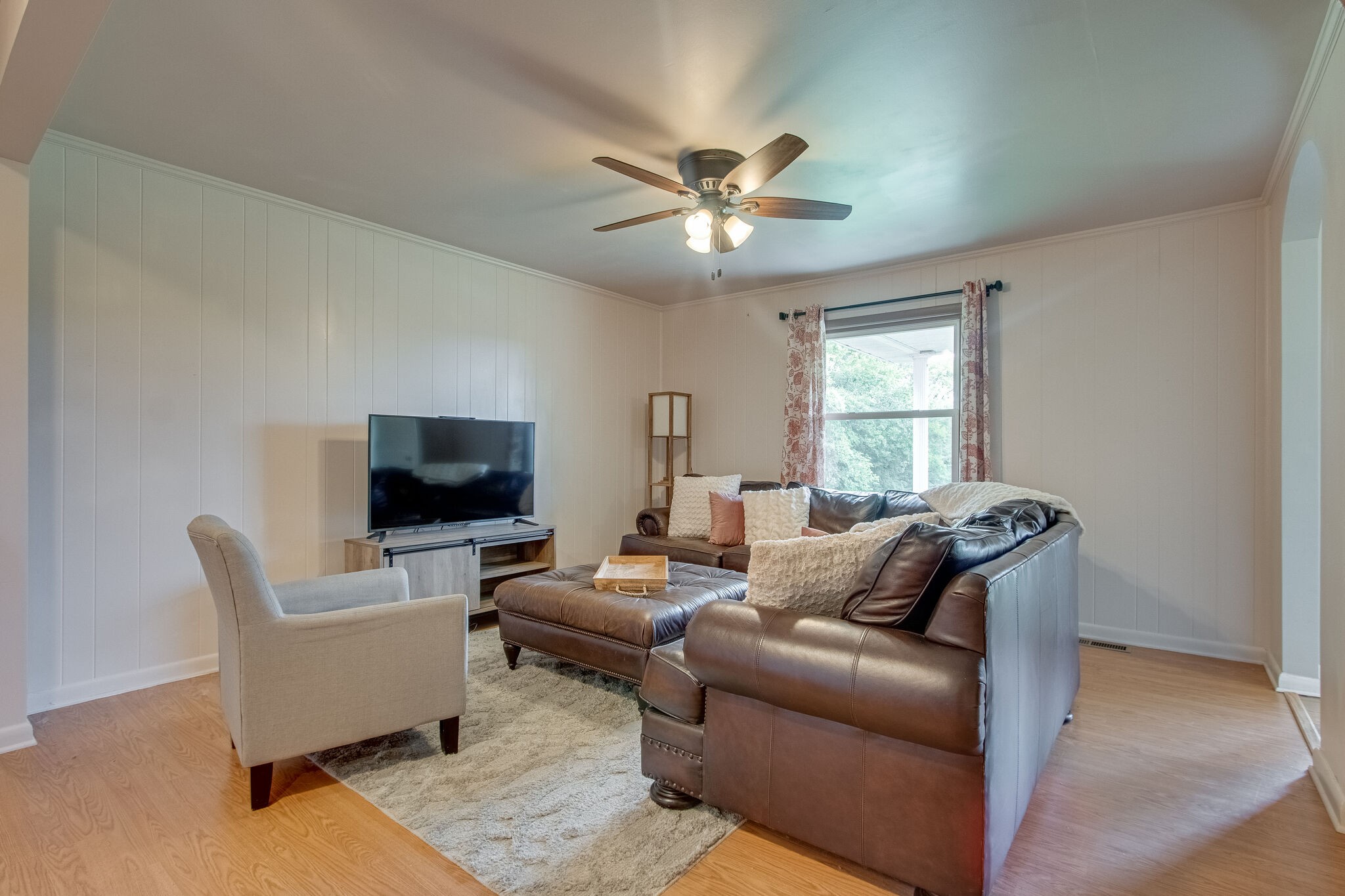 4543 South Carothers Road Franklin, TN 37064 - Photo 10 of 34 a living room with furniture and a flat screen tv