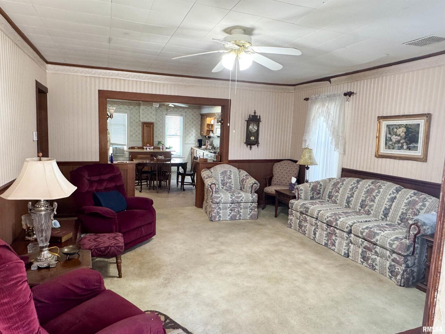 1325 Beech Grove Road Wolf Lake, IL 62998 - Photo 15 of 31 a living room with furniture and a chandelier