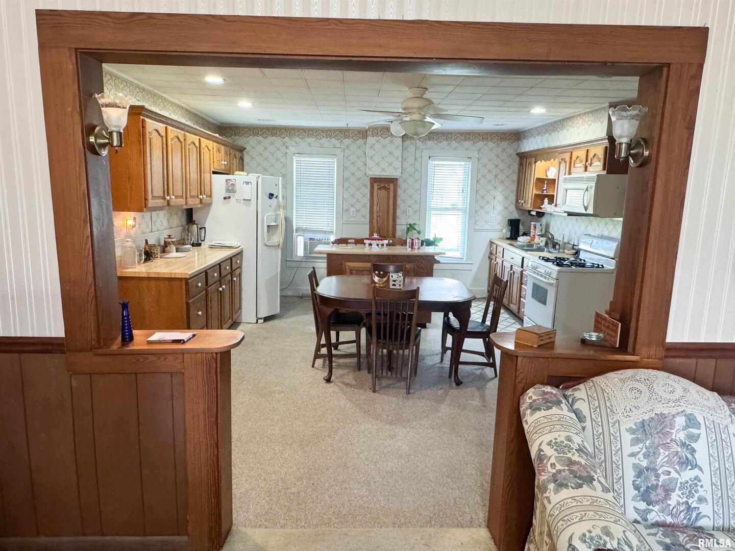 1325 Beech Grove Road Wolf Lake, IL 62998 - Photo 17 of 31 a view of a dining room with furniture and a chandelier