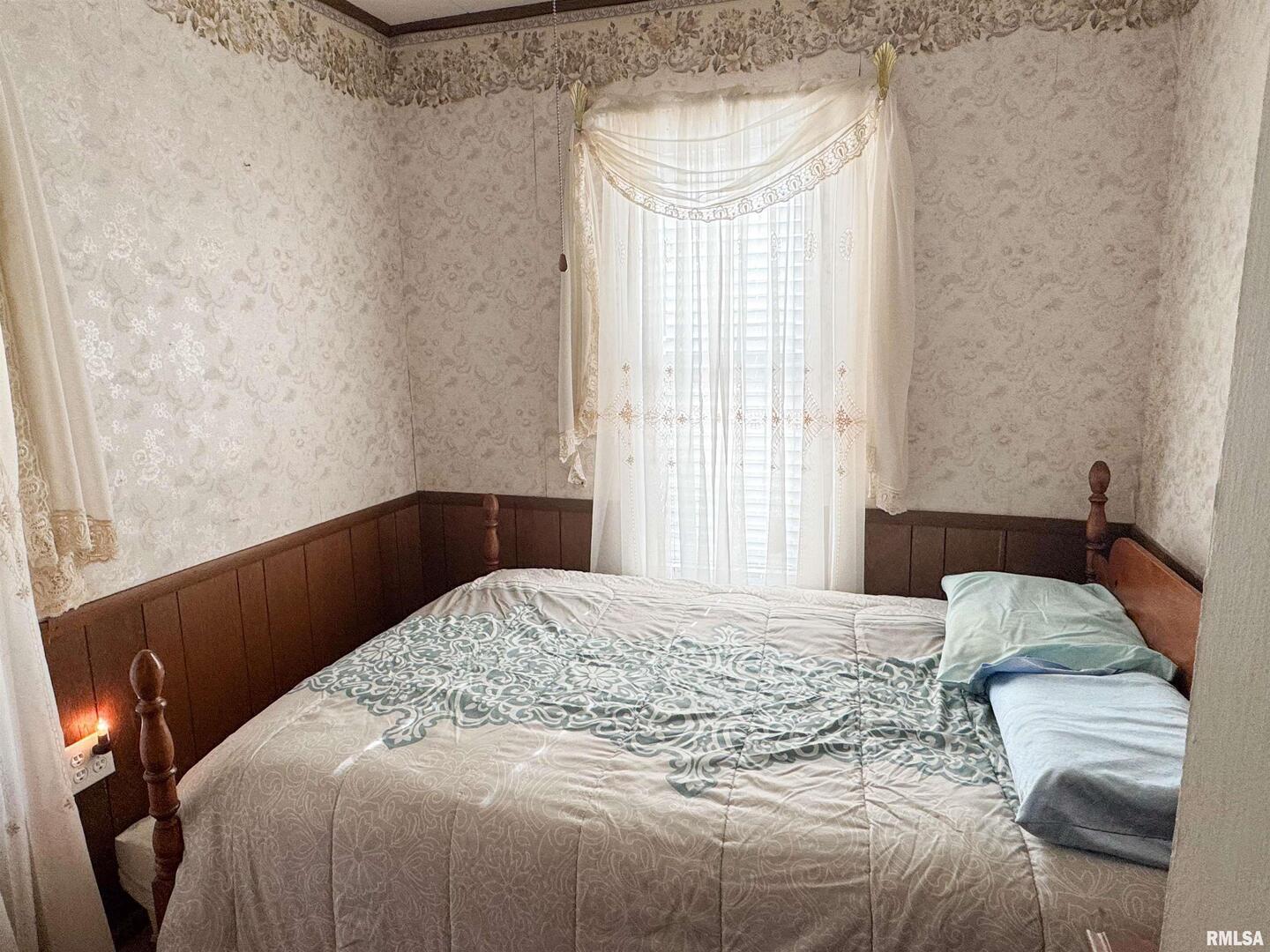 1325 Beech Grove Road Wolf Lake, IL 62998 - Photo 23 of 31 a bedroom with a bed and a window