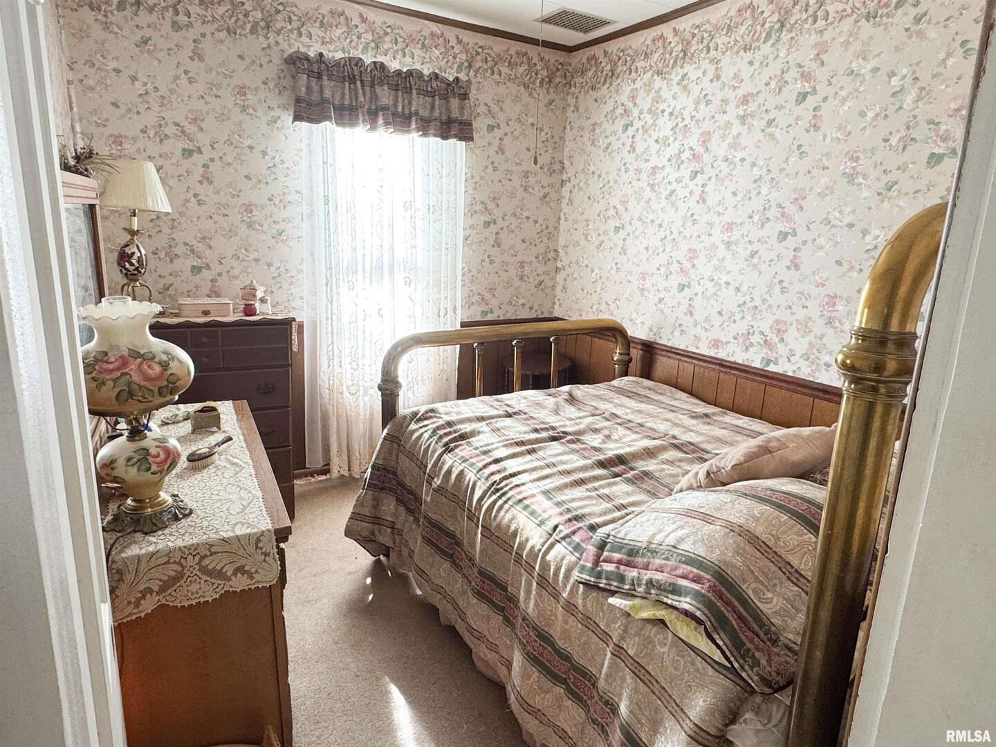 1325 Beech Grove Road Wolf Lake, IL 62998 - Photo 24 of 31 a bedroom with a bed and a window