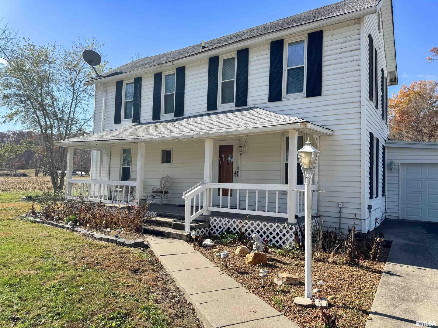 1325 Beech Grove Road Wolf Lake, IL 62998 - Photo 6 of 31 a front view of a house with a porch