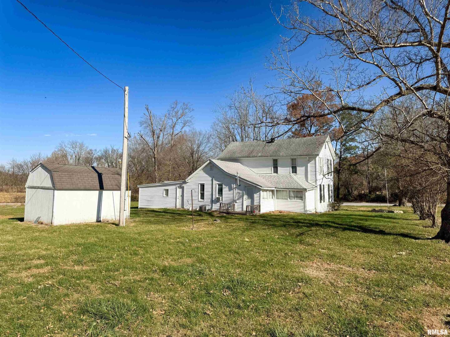 1325 Beech Grove Road Wolf Lake, IL 62998 - Photo 7 of 31 a view of a house with a big yard