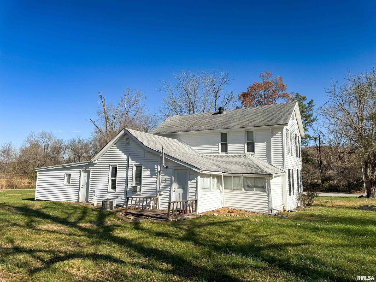 1325 Beech Grove Road Wolf Lake, IL 62998 - Photo 9 of 31 a front view of a house with a garden