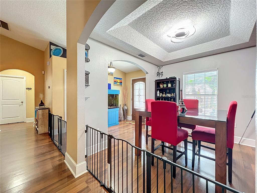 1312 Perkins Road Orlando, FL 32809 - Photo 14 of 80 a view of a dining room with furniture window and wooden floor