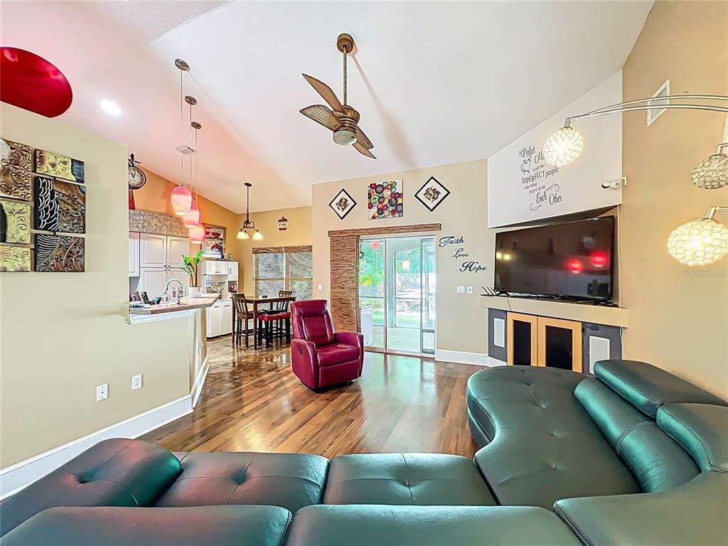 1312 Perkins Road Orlando, FL 32809 - Photo 17 of 80 a living room with furniture and a flat screen tv