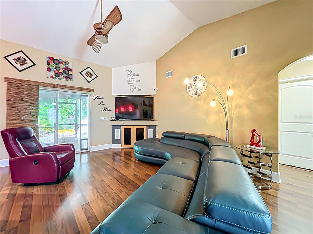 1312 Perkins Road Orlando, FL 32809 - Photo 18 of 80 a living room with furniture and a flat screen tv