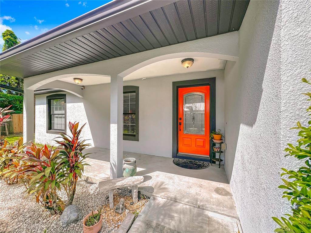 1312 Perkins Road Orlando, FL 32809 - Photo 2 of 80 a front view of a house with a yard