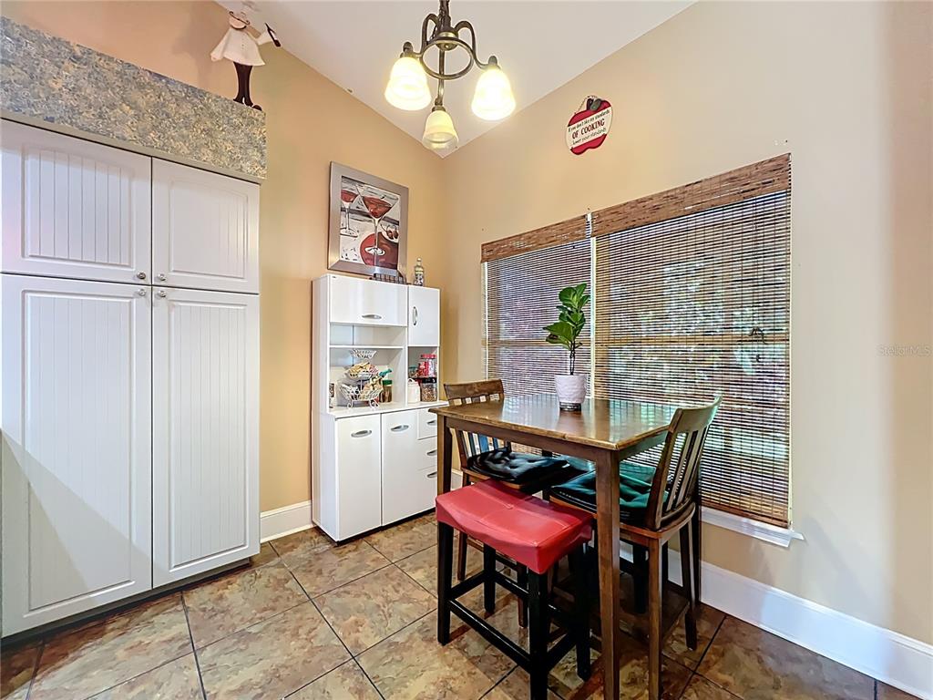 1312 Perkins Road Orlando, FL 32809 - Photo 27 of 80 a view of a dining room with furniture