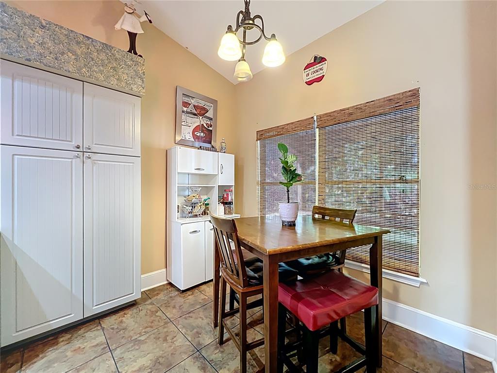 1312 Perkins Road Orlando, FL 32809 - Photo 28 of 80 a view of a dining room with furniture window and wooden floor