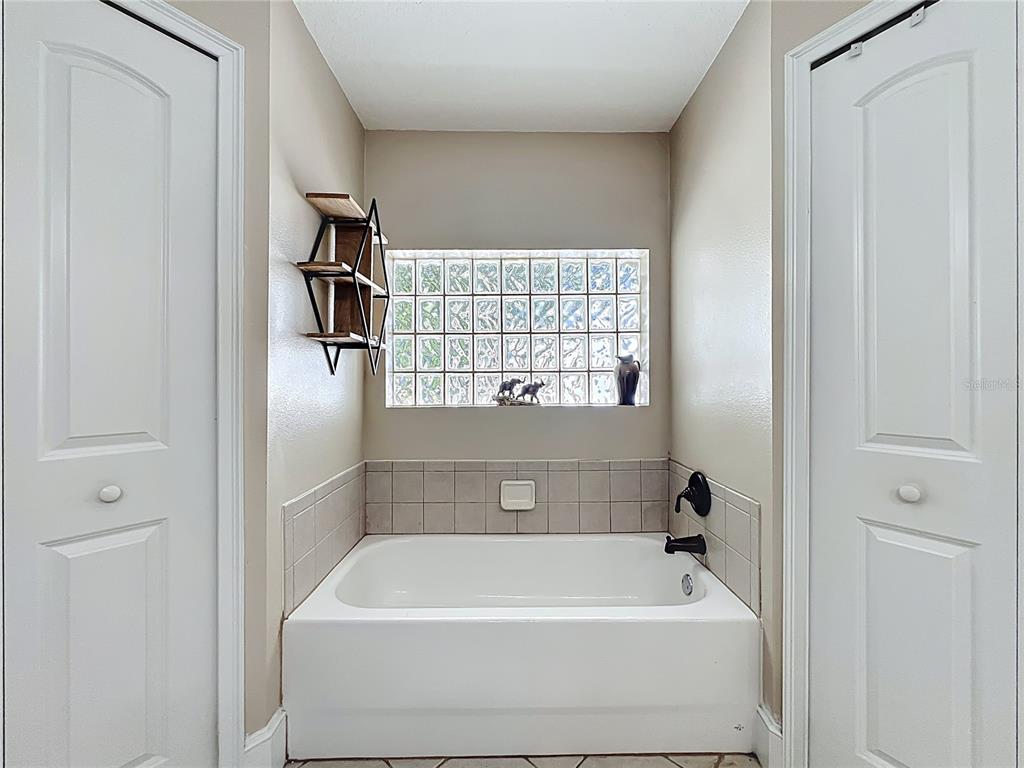 1312 Perkins Road Orlando, FL 32809 - Photo 39 of 80 a bathroom with a bathtub
