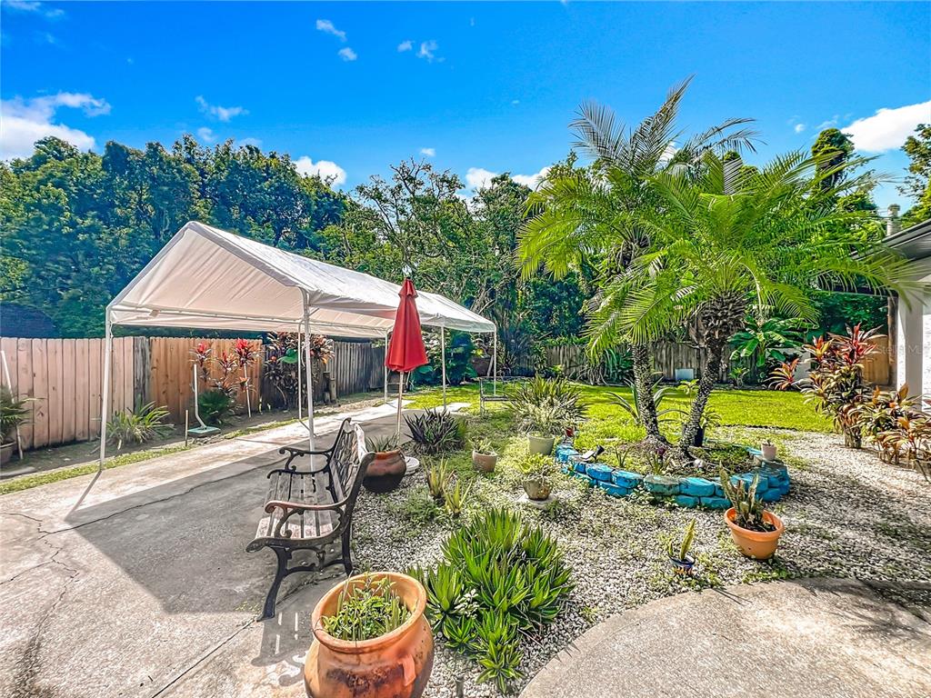 1312 Perkins Road Orlando, FL 32809 - Photo 4 of 80 a view of a swimming pool with a patio and a yard