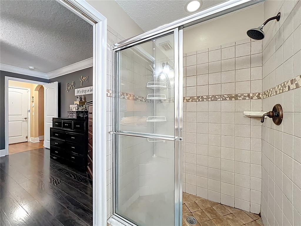 1312 Perkins Road Orlando, FL 32809 - Photo 43 of 80 a bathroom with a glass shower door