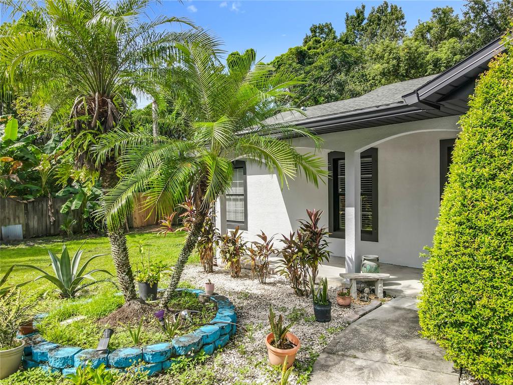 1312 Perkins Road Orlando, FL 32809 - Photo 62 of 80 a front view of a house with a yard