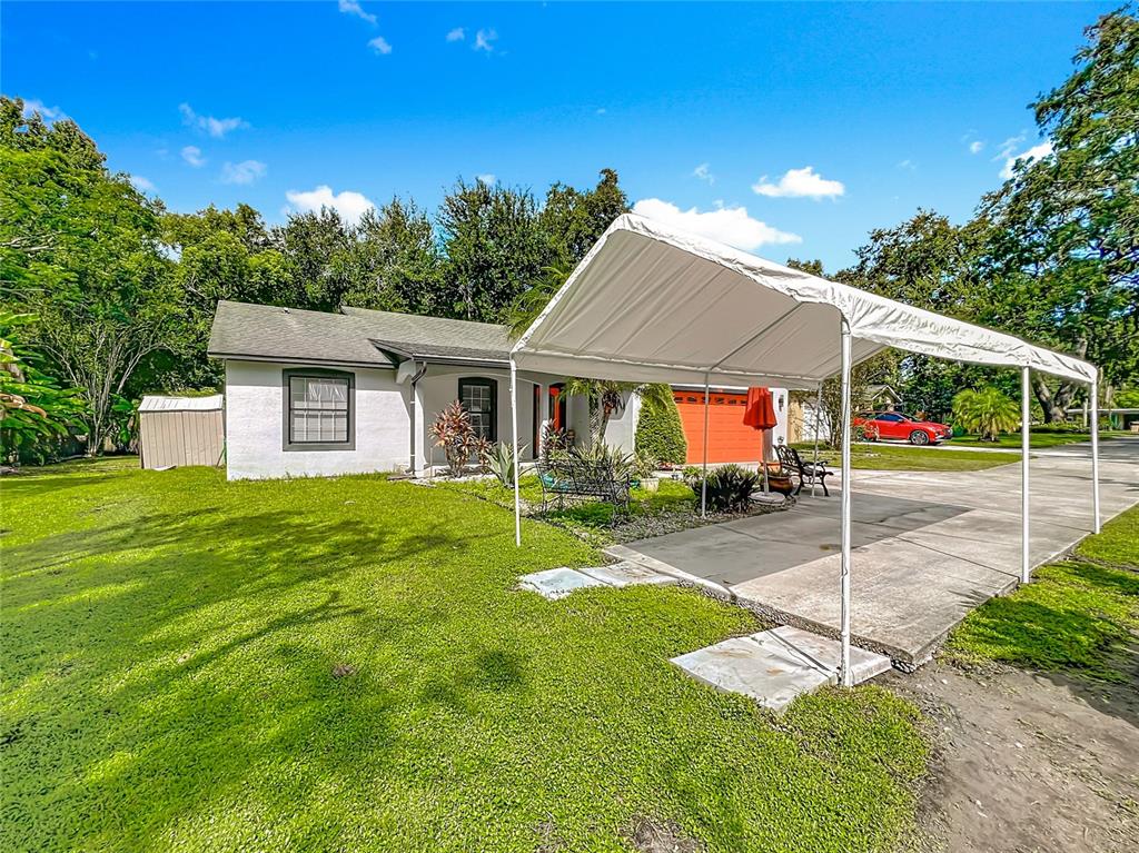 1312 Perkins Road Orlando, FL 32809 - Photo 67 of 80 a view of a house with a yard and tree s
