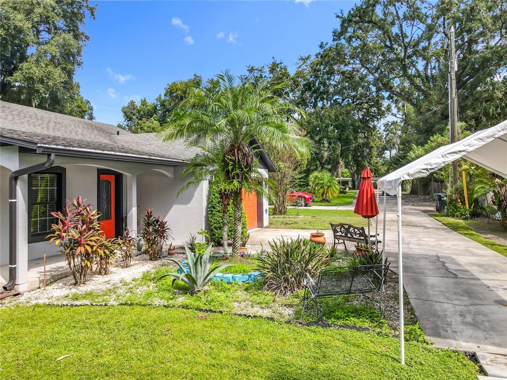 1312 Perkins Road Orlando, FL 32809 - Photo 70 of 80 a front view of a house with a yard