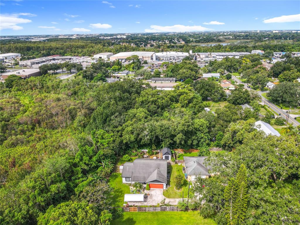 1312 Perkins Road Orlando, FL 32809 - Photo 75 of 80 an aerial view of residential houses with outdoor space and trees