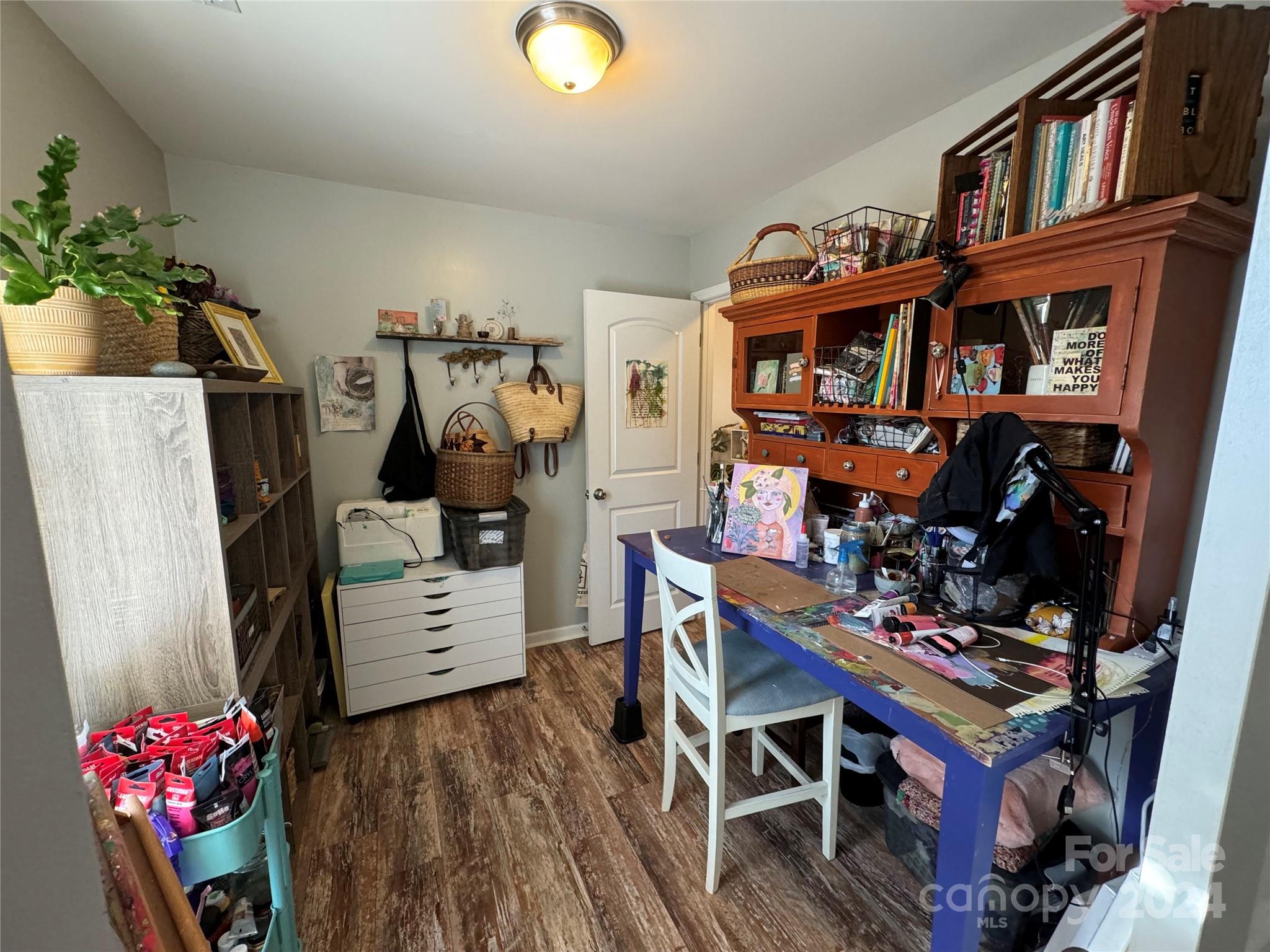 162 Limerick Road, Unit A Mooresville, NC 28115 - Photo 13 of 20 a living room with furniture and a book shelf