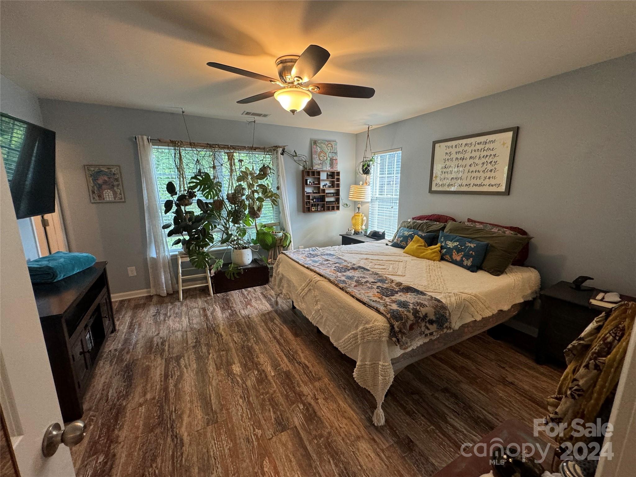 162 Limerick Road, Unit A Mooresville, NC 28115 - Photo 14 of 20 a bedroom with a bed and a flat tv screen on dresser