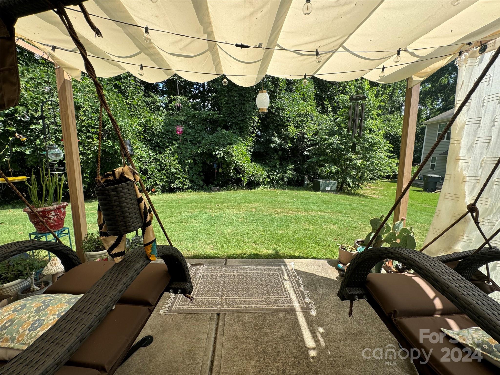 162 Limerick Road, Unit A Mooresville, NC 28115 - Photo 18 of 20 a view of a chairs and table in the patio