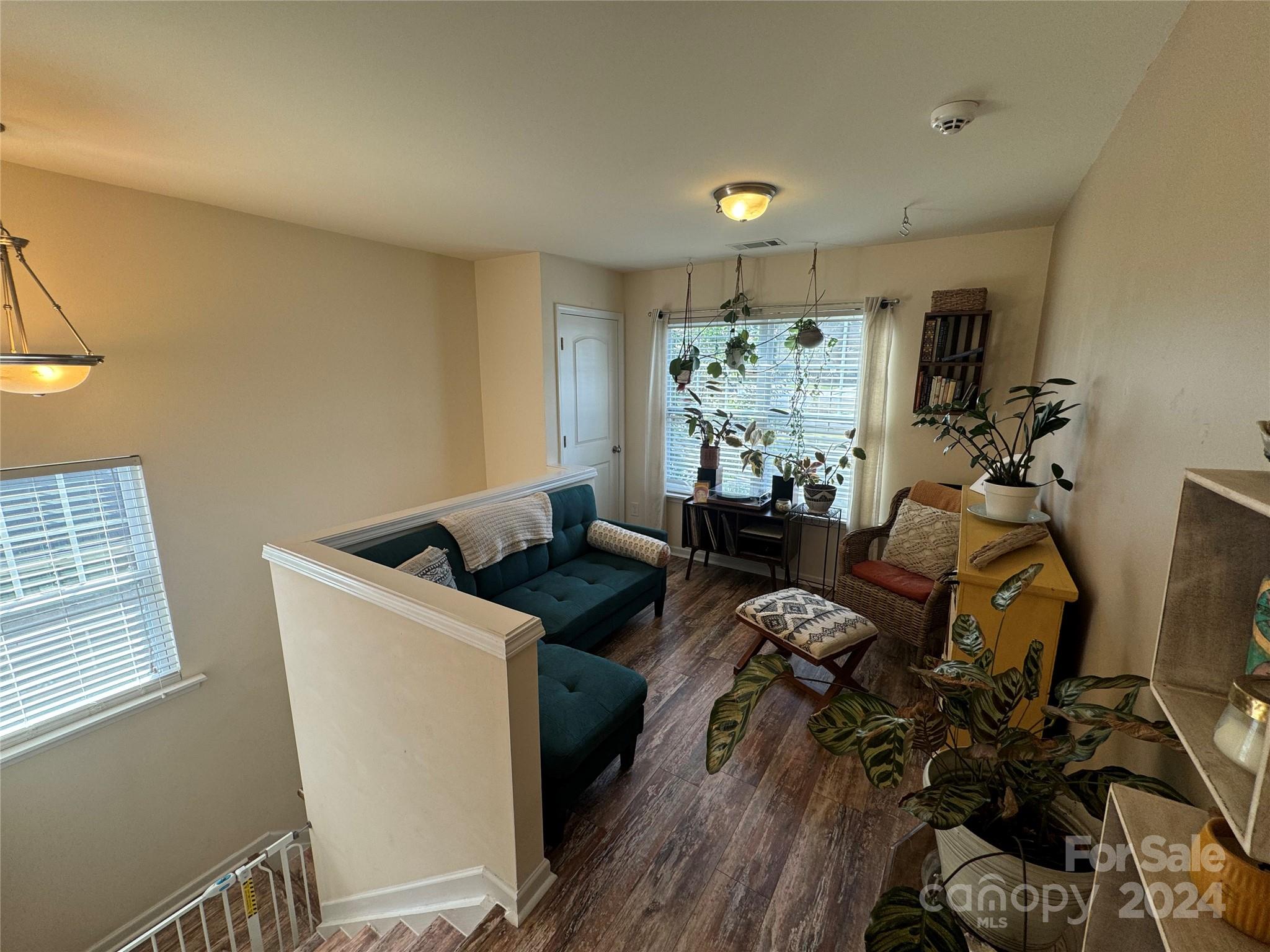 162 Limerick Road, Unit A Mooresville, NC 28115 - Photo 8 of 20 a living room with furniture a window and a flat screen tv
