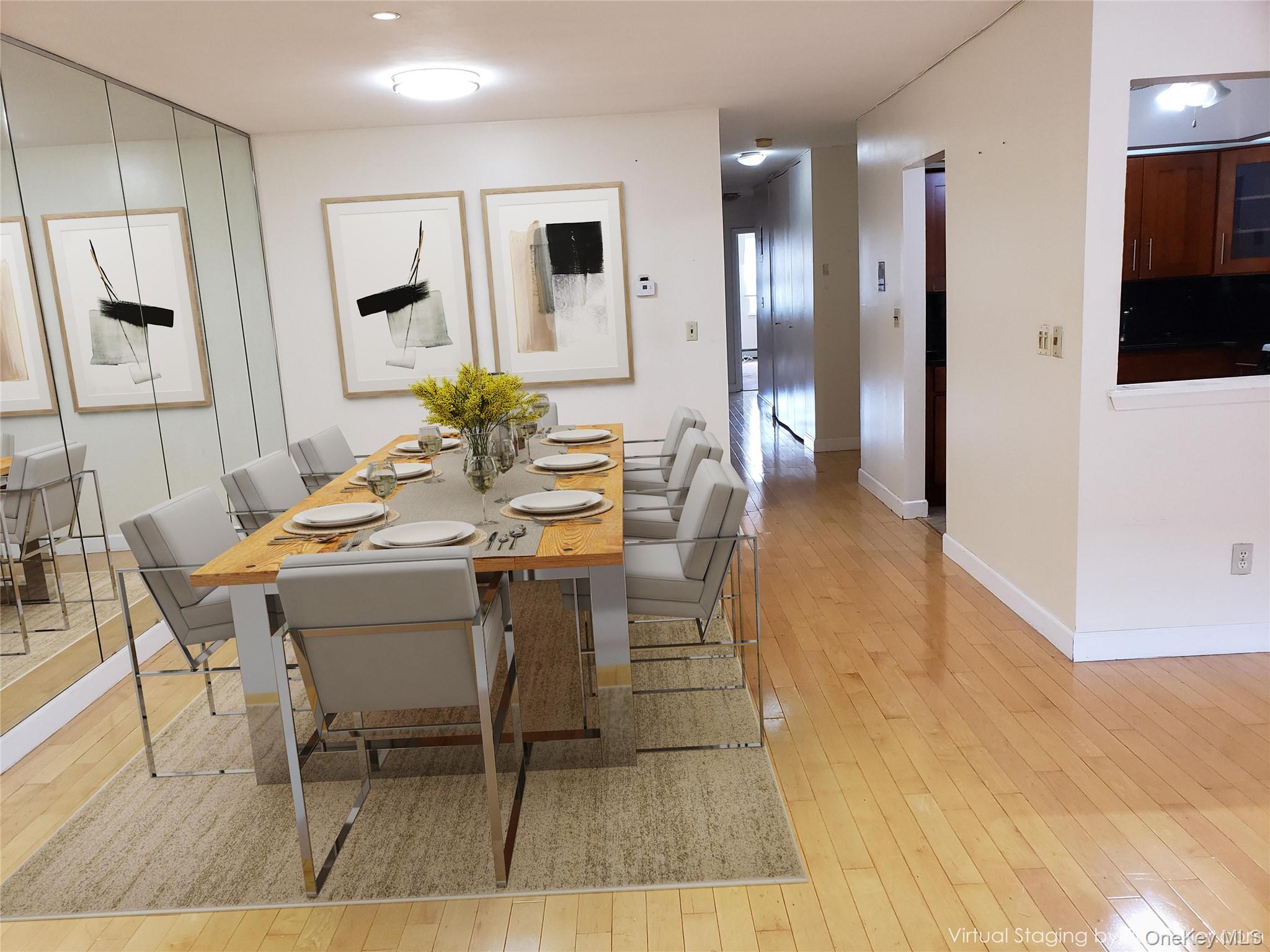 12-30 Estates Lane, Unit 2 Queens, NY 11360 - Photo 3 of 9 Dining space featuring light wood-style floors and baseboards