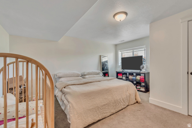 1071 Jamie-Matt Circle Layton, UT 84041 - Photo 13 of 28 Bedroom featuring carpet and baseboards