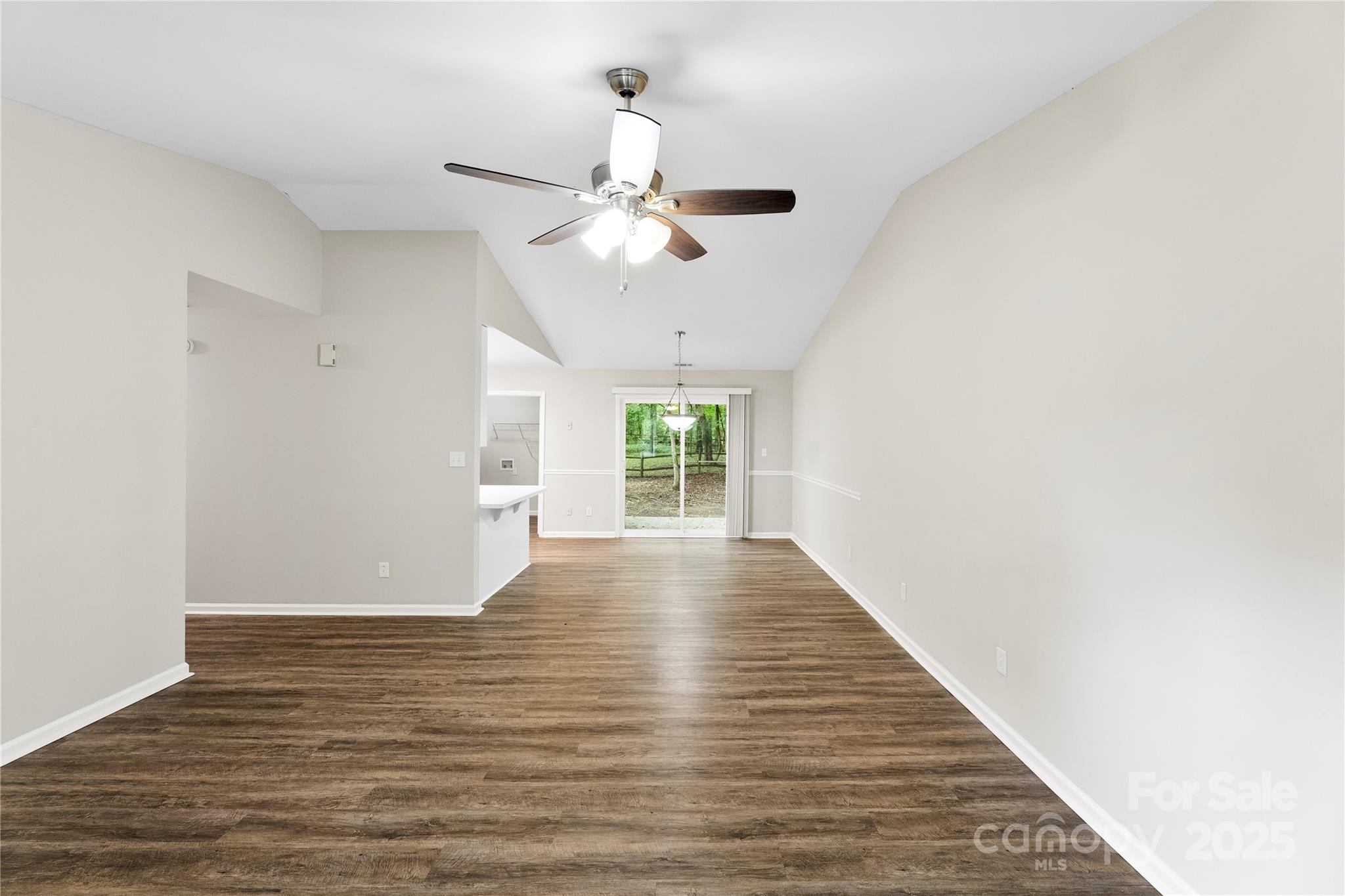 2713 Faircroft Way Monroe, NC 28110 - Photo 15 of 25 a view of an empty room with wooden floor ceiling fan