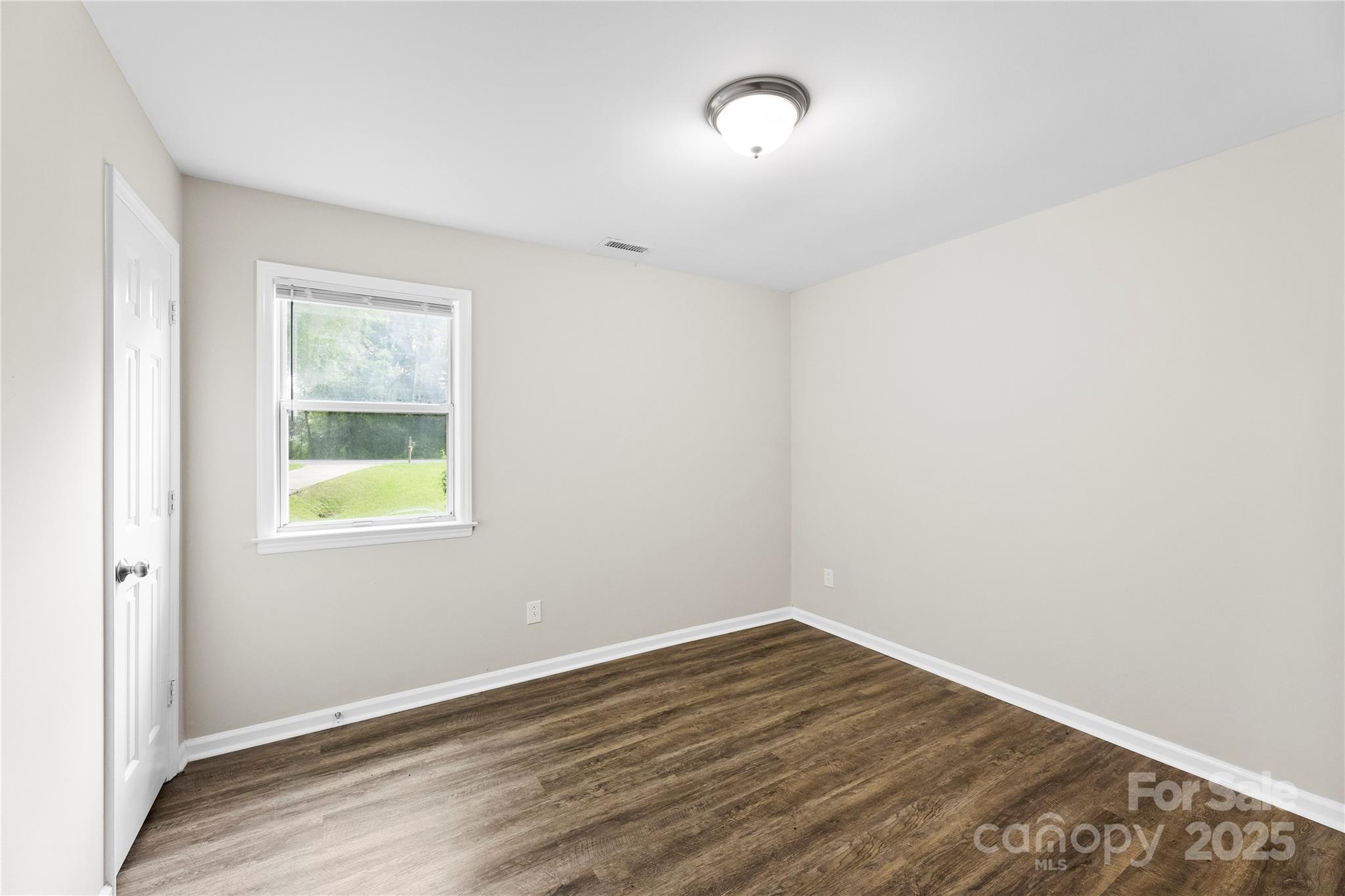 2713 Faircroft Way Monroe, NC 28110 - Photo 22 of 25 an empty room with a window