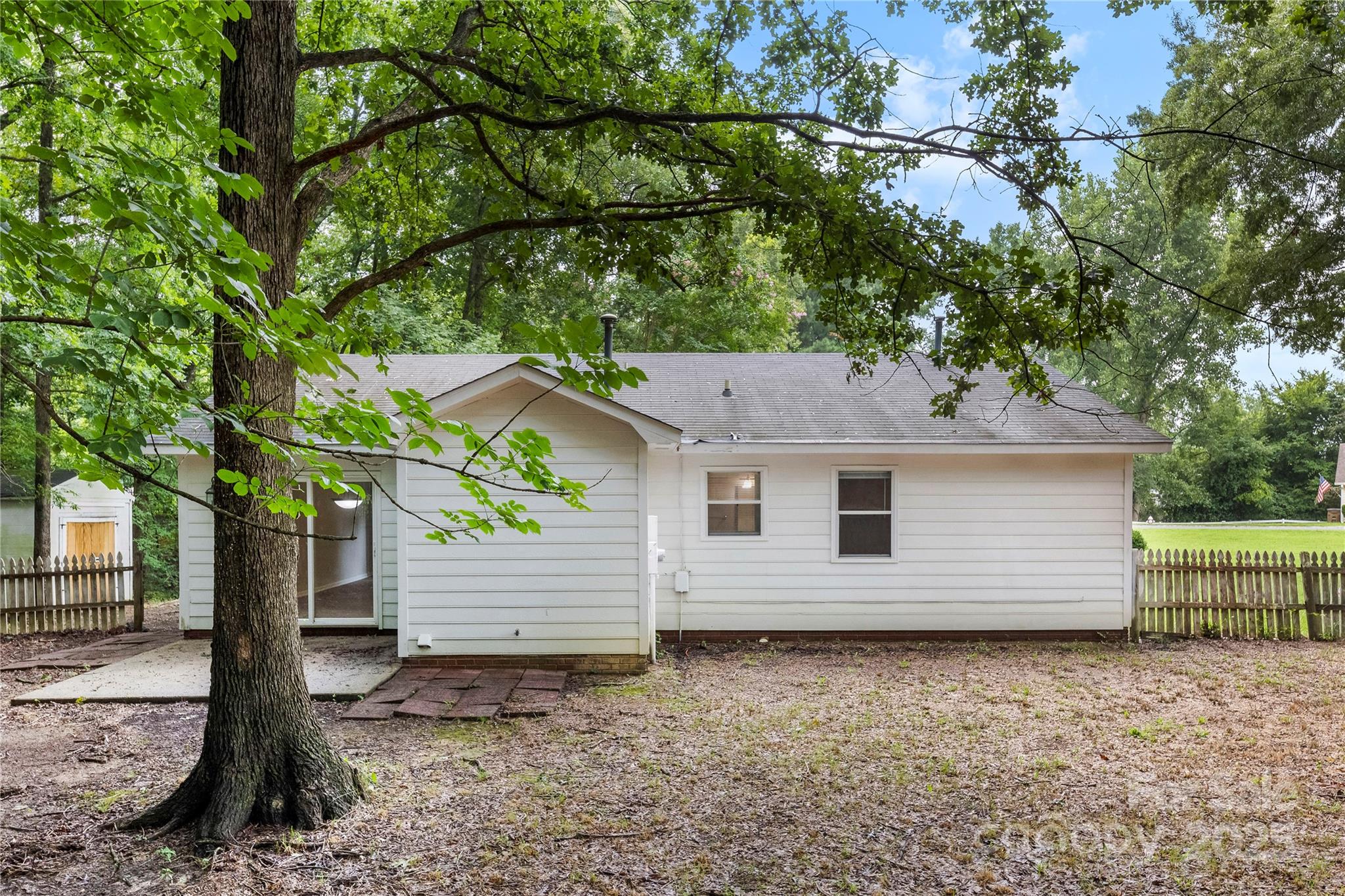 2713 Faircroft Way Monroe, NC 28110 - Photo 25 of 25 a backyard of a house with lots of green space