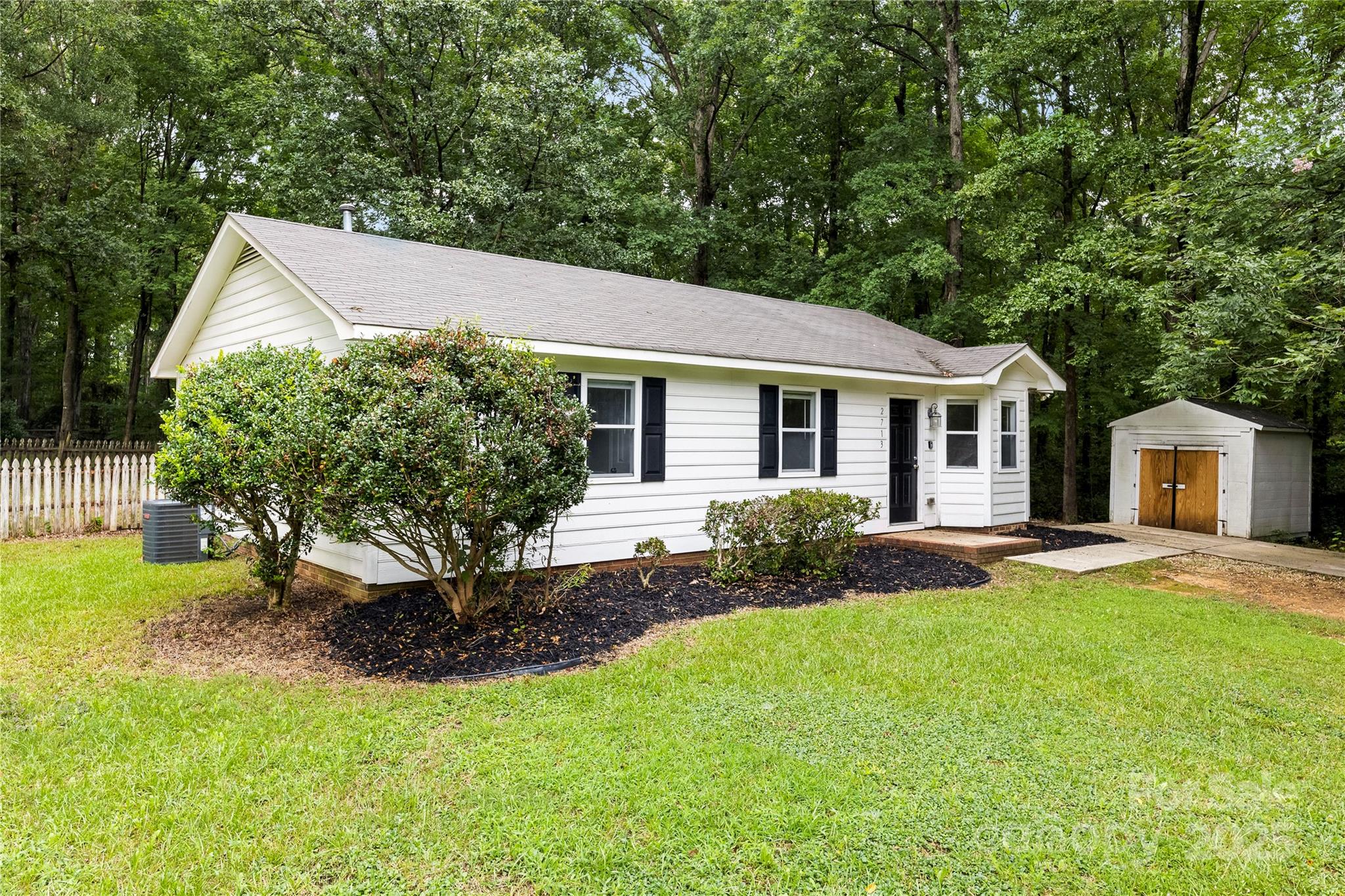 2713 Faircroft Way Monroe, NC 28110 - Photo 6 of 25 a backyard of a house with yard and barbeque oven