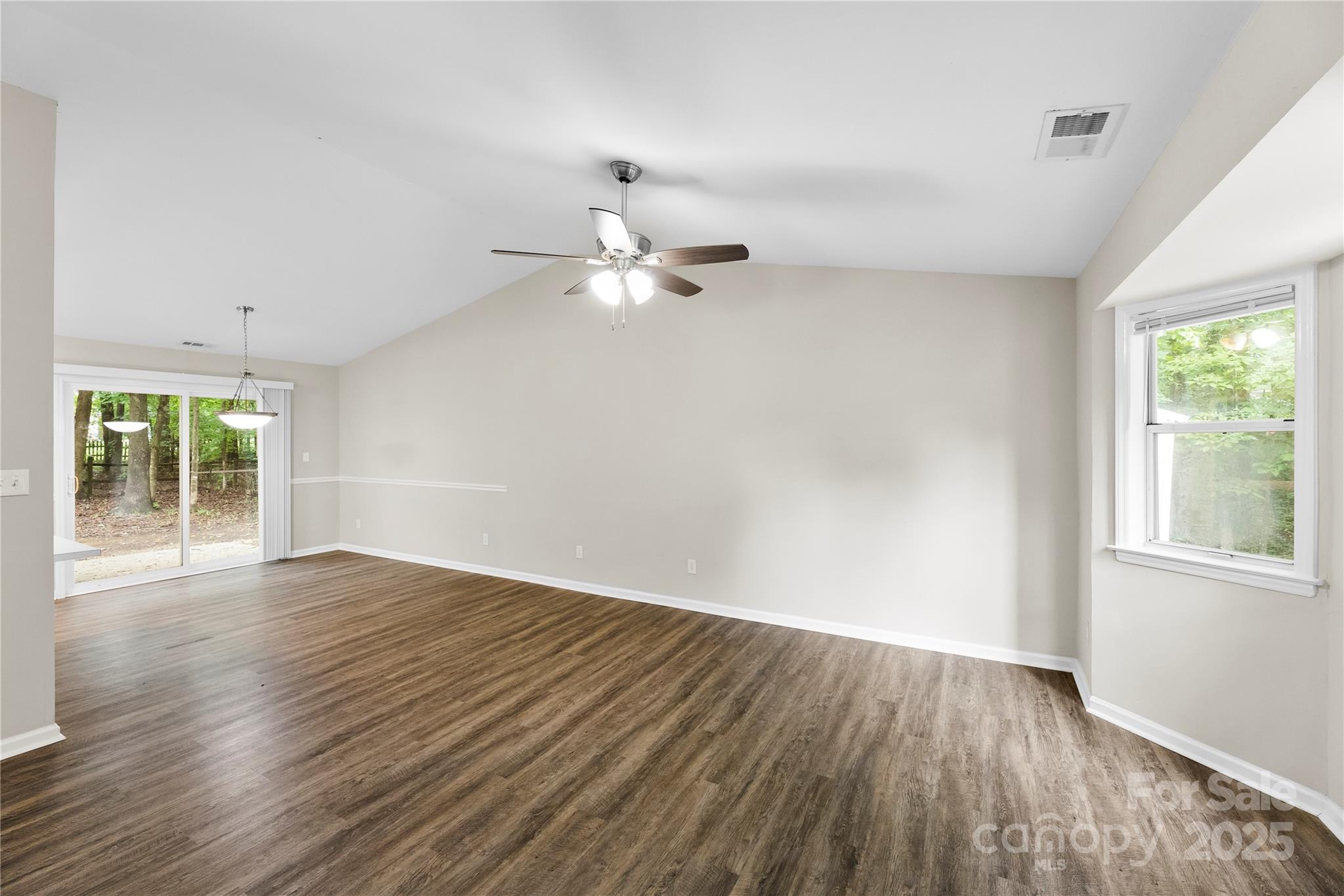 2713 Faircroft Way Monroe, NC 28110 - Photo 8 of 25 wooden floor in an empty room with a window