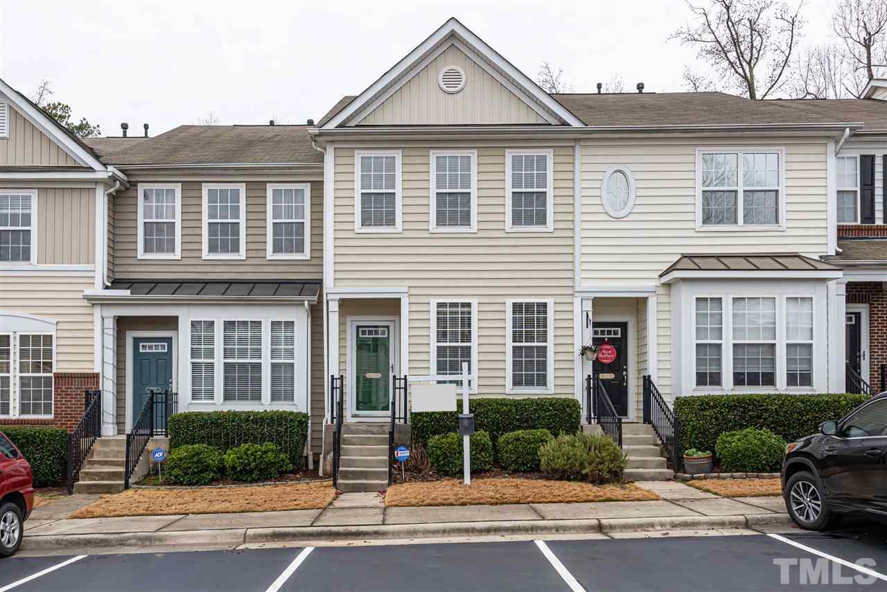 7749 Winners Edge Street Raleigh, NC 27617 - Photo 1 of 29 a front view of a house with a yard
