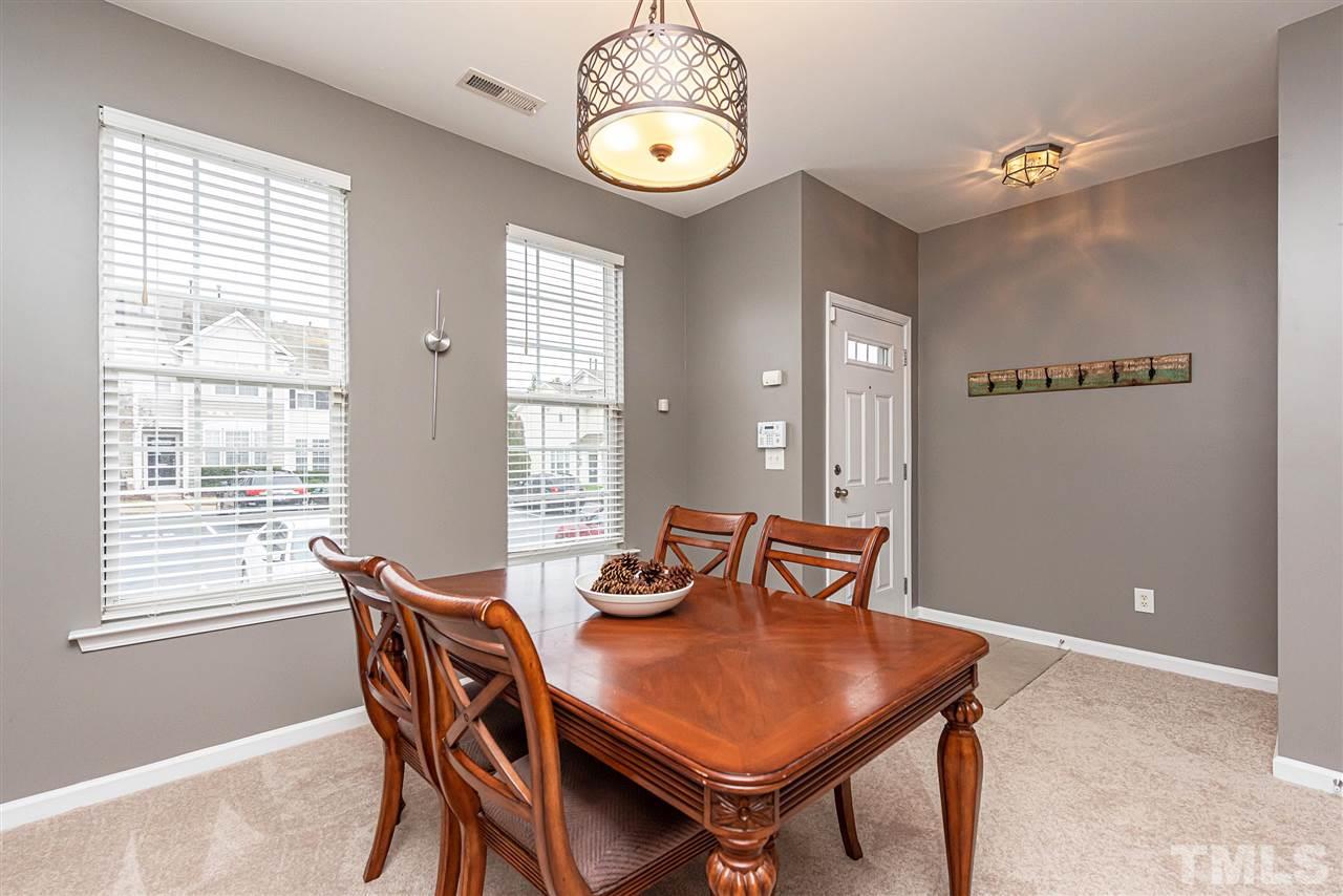 7749 Winners Edge Street Raleigh, NC 27617 - Photo 2 of 29 a view of a dining room with furniture and window