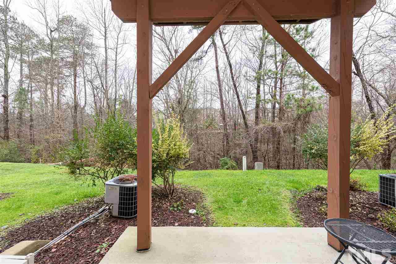 7749 Winners Edge Street Raleigh, NC 27617 - Photo 24 of 29 a view of a garden with a tree
