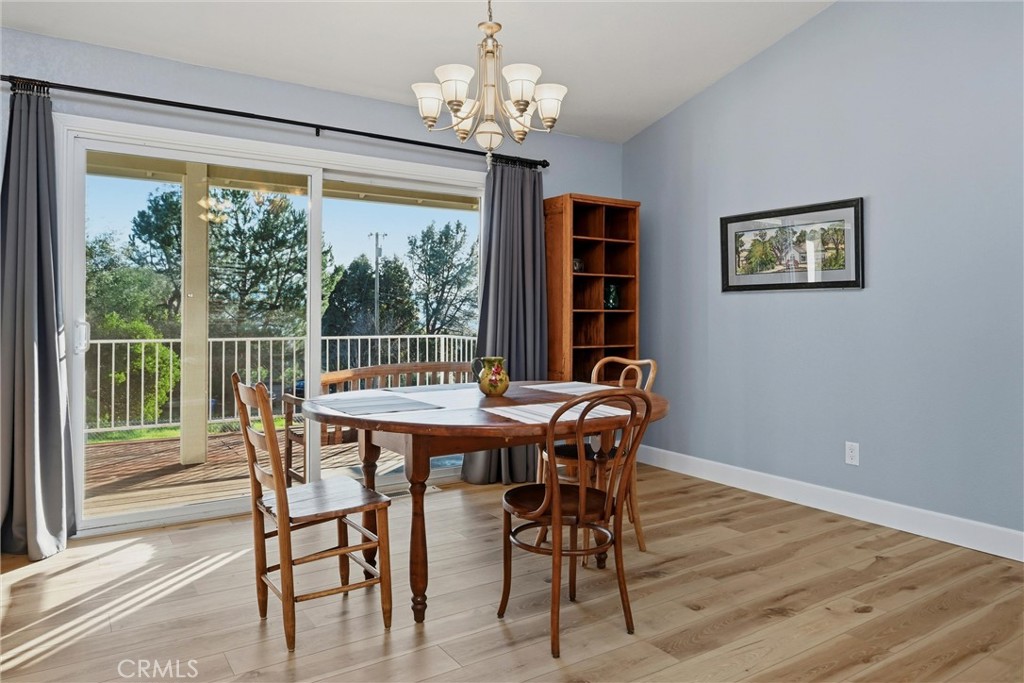 19093 Ravenhill Road Hidden Valley Lake, CA 95467 - Photo 11 of 30 a view of a dining room with furniture window and outside view