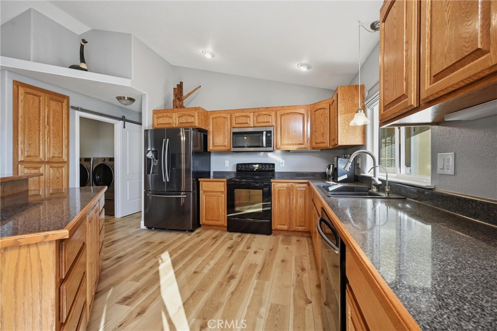 19093 Ravenhill Road Hidden Valley Lake, CA 95467 - Photo 16 of 30 a kitchen with stainless steel appliances granite countertop a refrigerator a stove top oven a sink and dishwasher