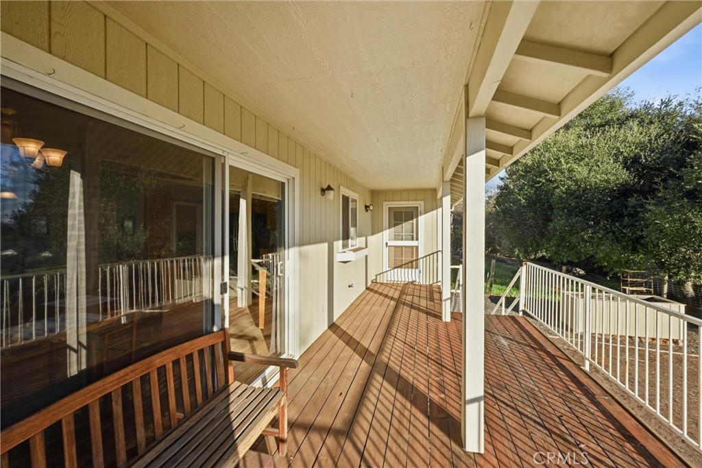 19093 Ravenhill Road Hidden Valley Lake, CA 95467 - Photo 28 of 30 a view of balcony with wooden floor and outdoor seating