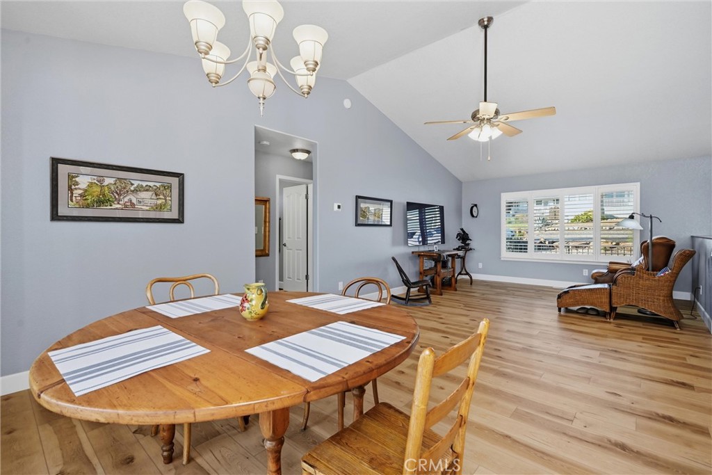 19093 Ravenhill Road Hidden Valley Lake, CA 95467 - Photo 10 of 30 a view of a dining room with furniture a chandelier and wooden floor
