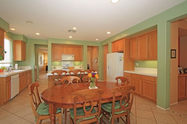 a view of a dining room with furniture and window