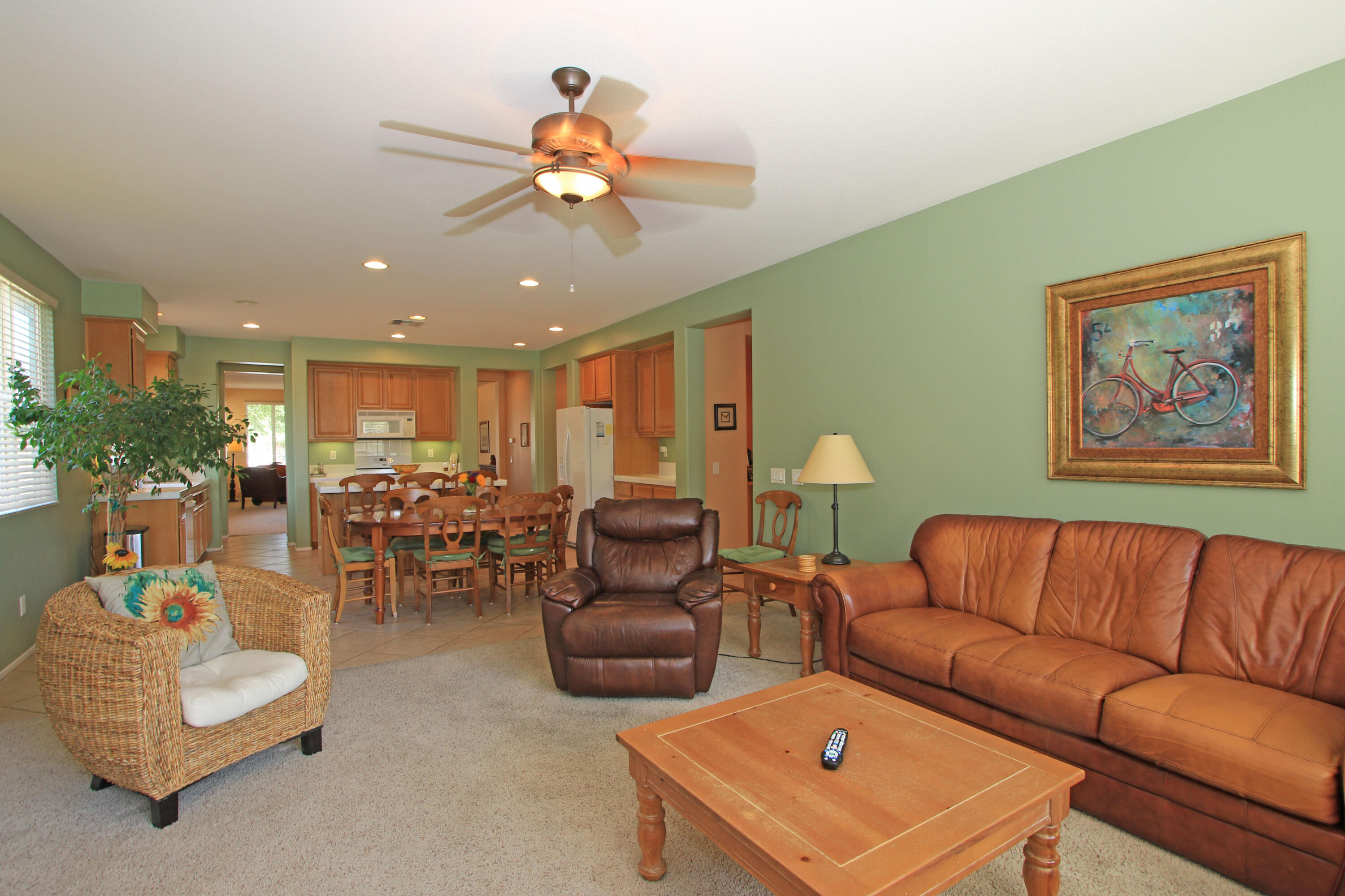 37330 Haweswater Road Indio, CA 92203 - Photo 17 of 47 a living room with furniture kitchen view and a chandelier