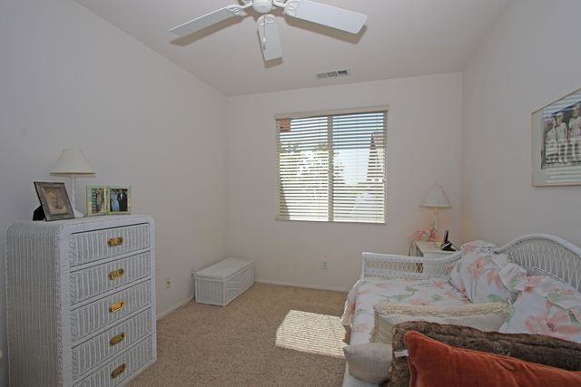 a bed room with a bed and a window