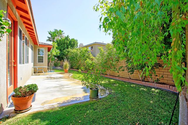 a backyard of a house with seating space