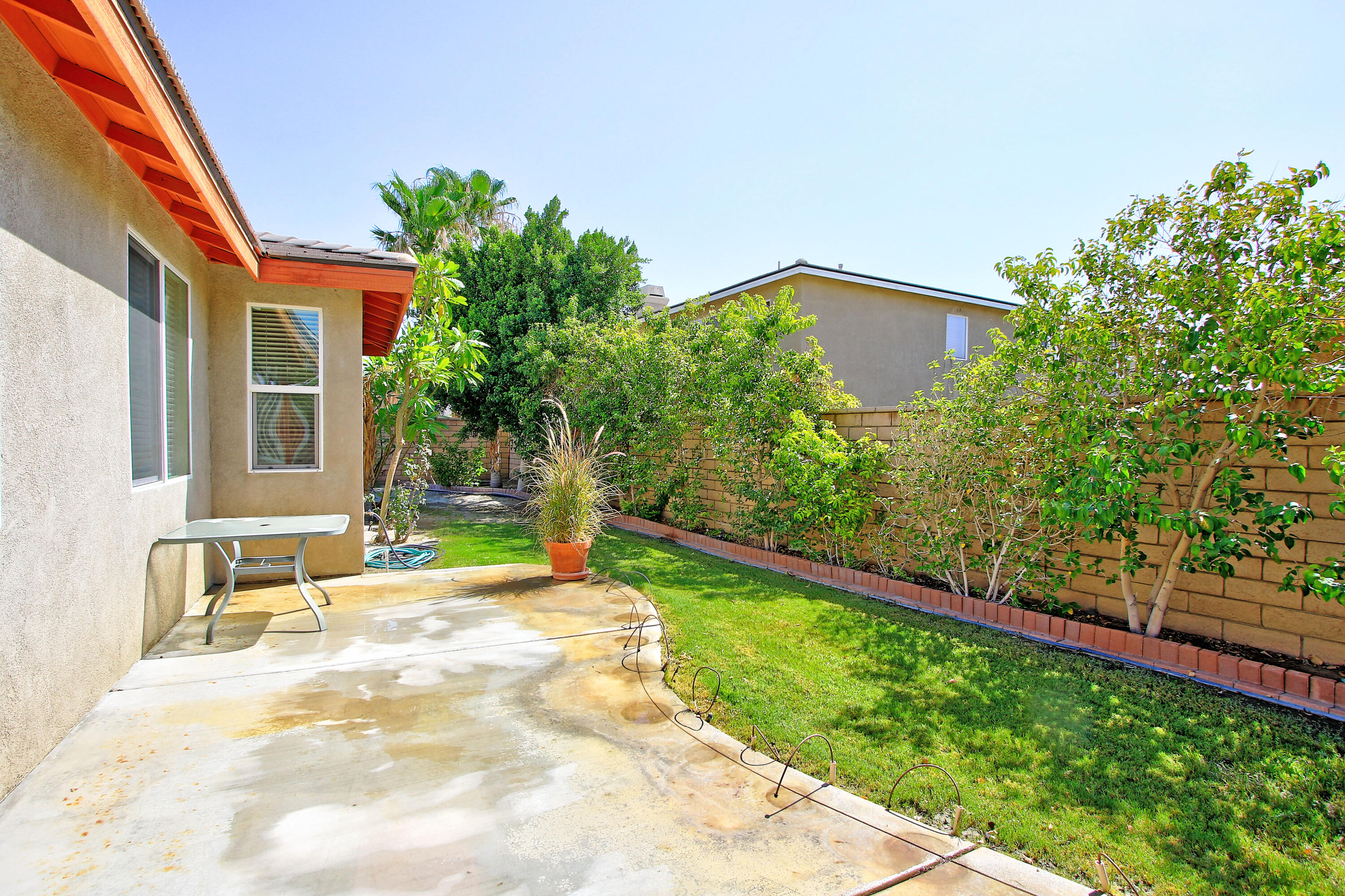 37330 Haweswater Road Indio, CA 92203 - Photo 37 of 47 a backyard of a house with seating space