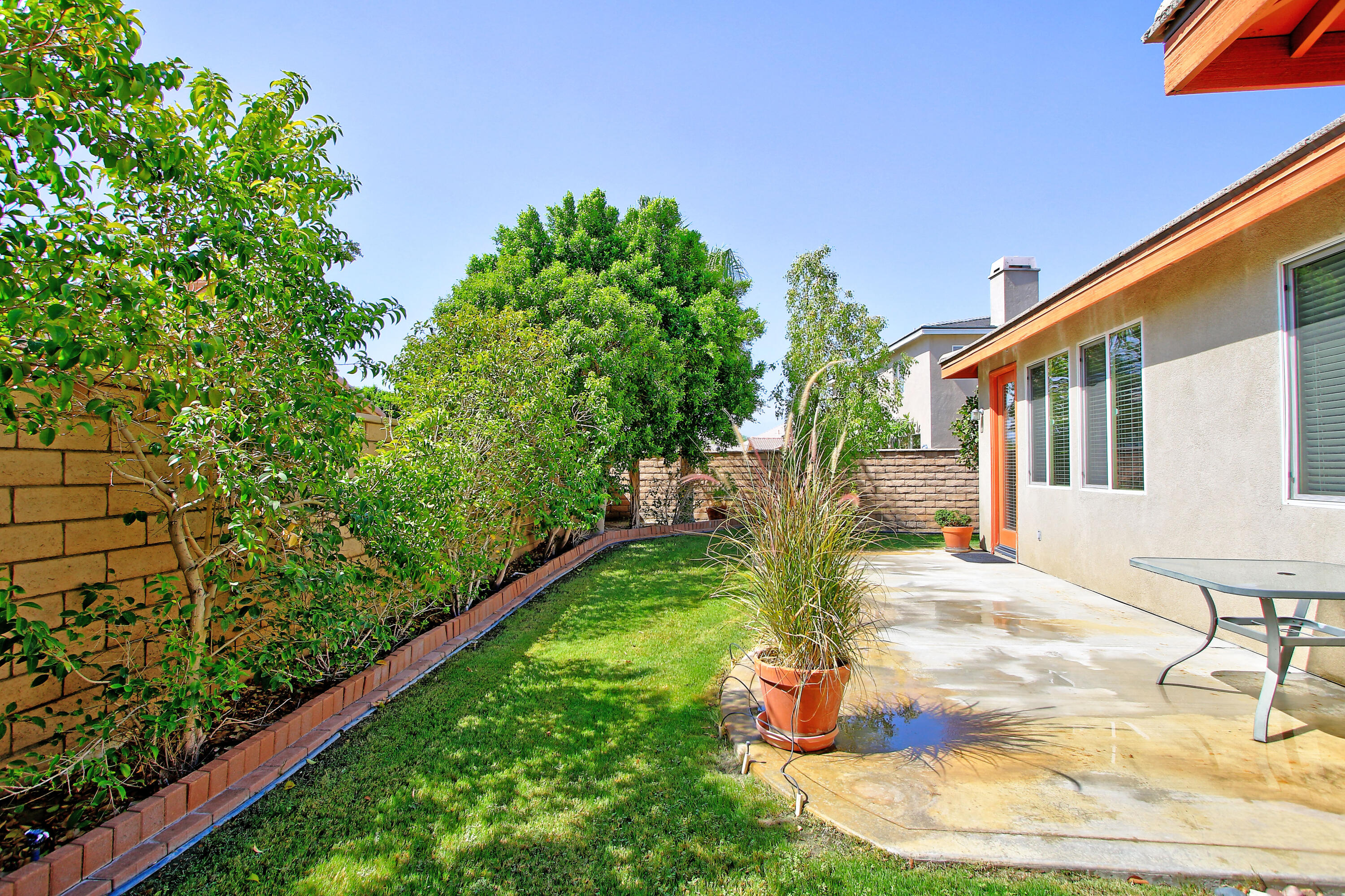 37330 Haweswater Road Indio, CA 92203 - Photo 38 of 47 a view of a backyard with plants and a patio