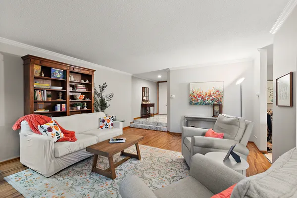 a kitchen with white cabinets appliances and a sink
