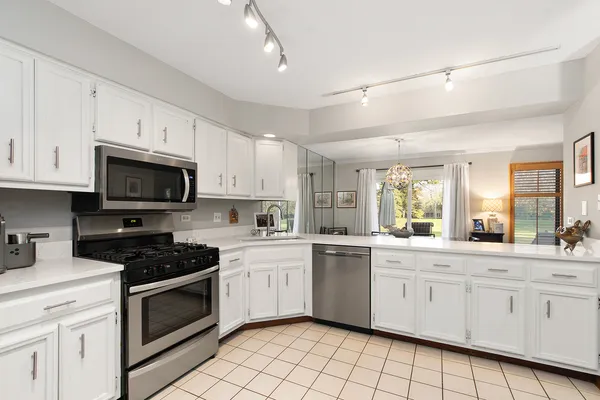 a view of a storage and utility room with washer and dryer