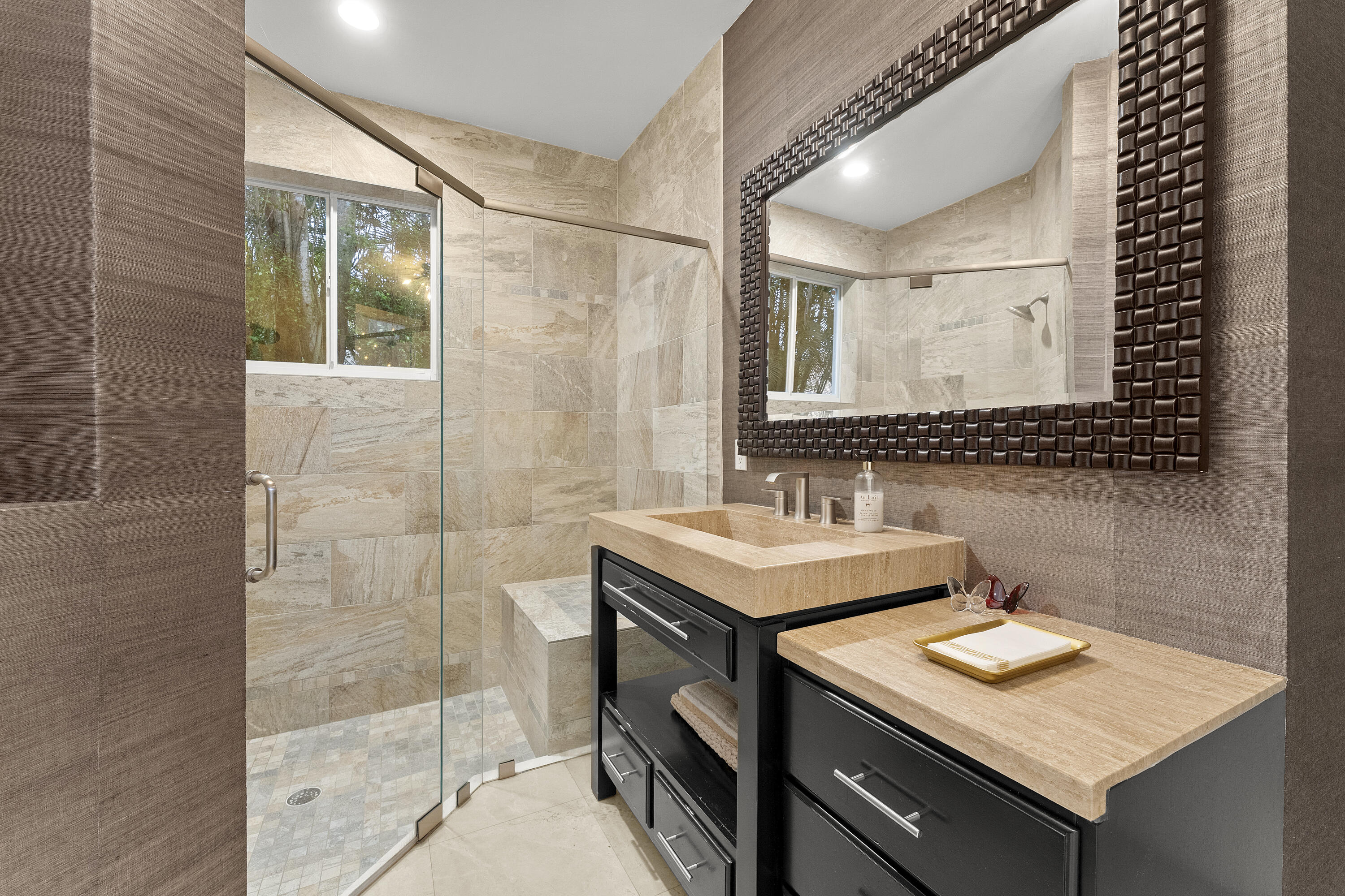 3156 Northwest 61st Street Boca Raton, FL 33496 - Photo 25 of 46 a bathroom with a sink a mirror and a shower
