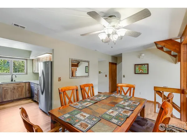 a bedroom with furniture and a large window