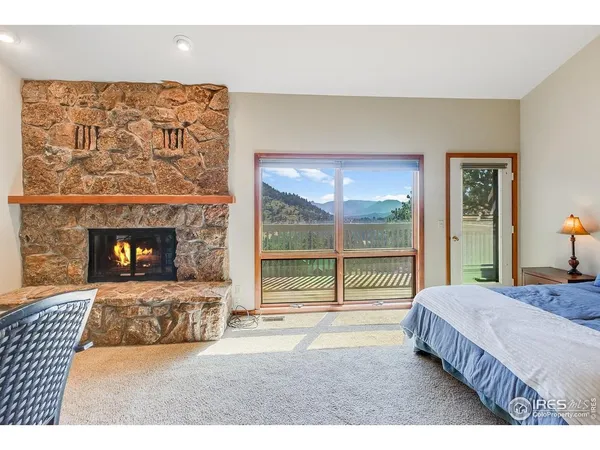 a bedroom with a bed and a fireplace